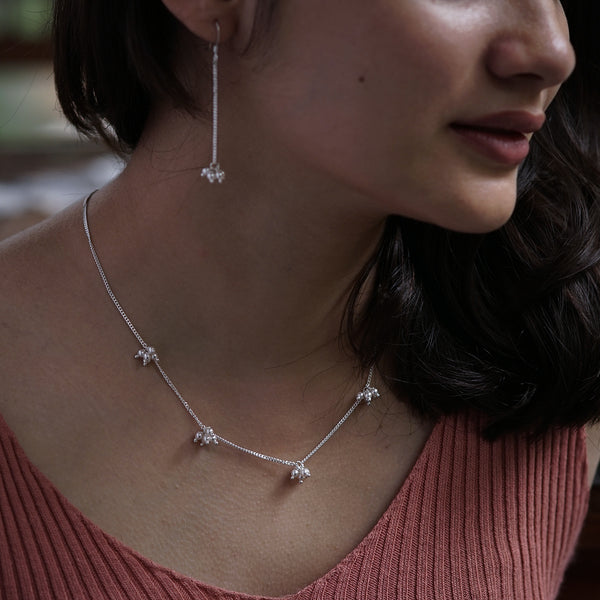 Silver pearl bunch jewelry set on model