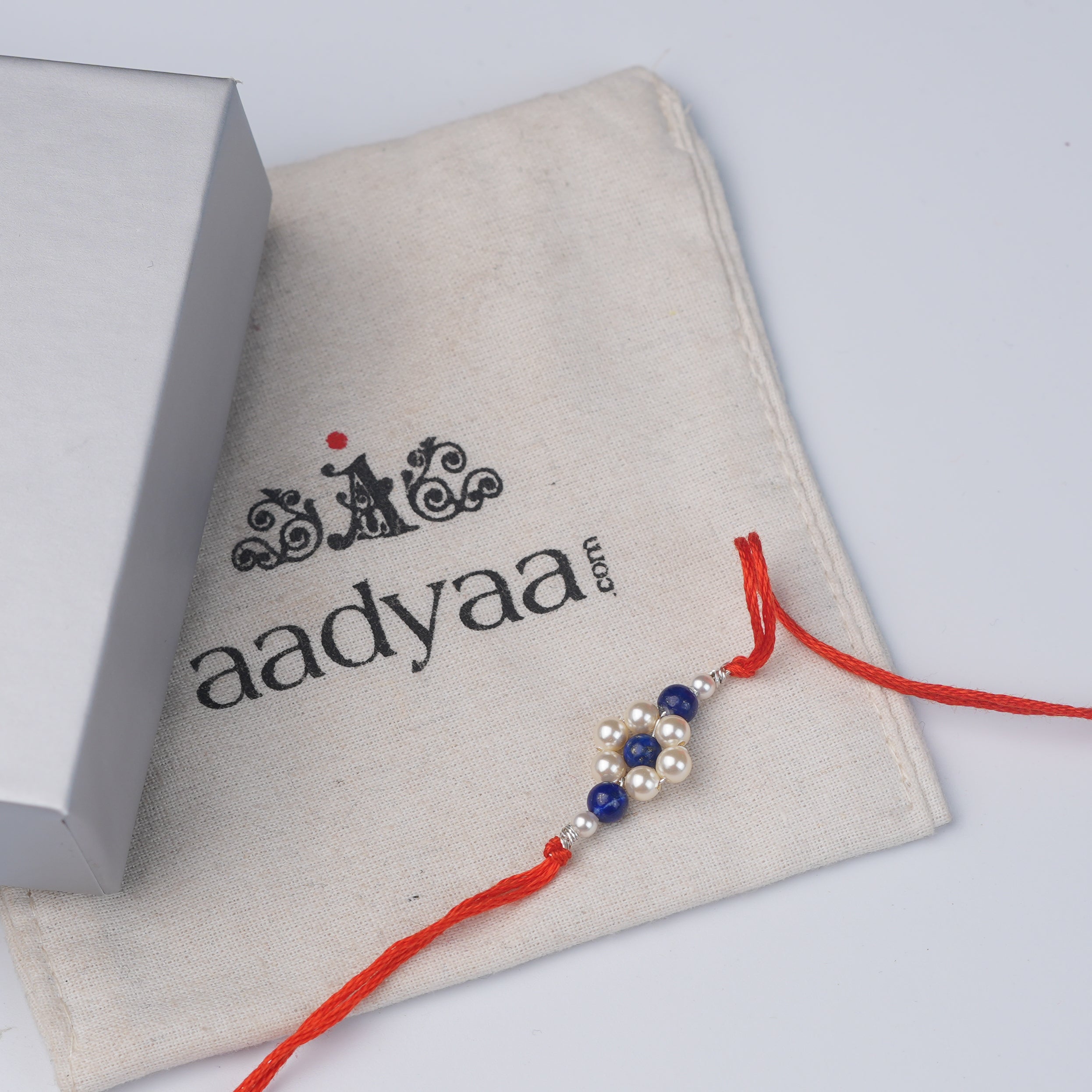 Lapis Lazuli & Pearl Flower Rakhi (Project Handmade)
