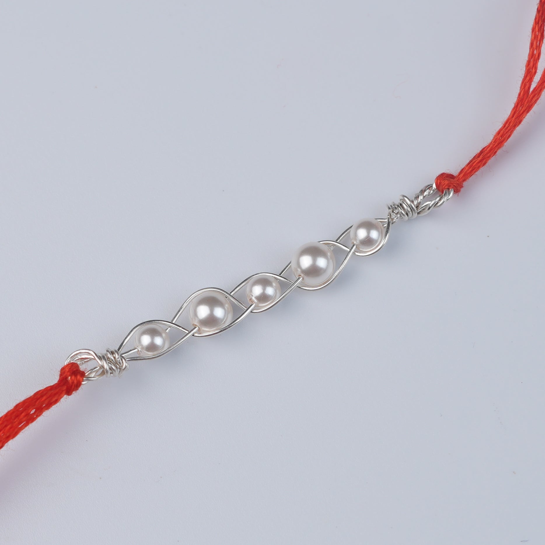 Pearl Wrapped Rakhi (Project Handmade)