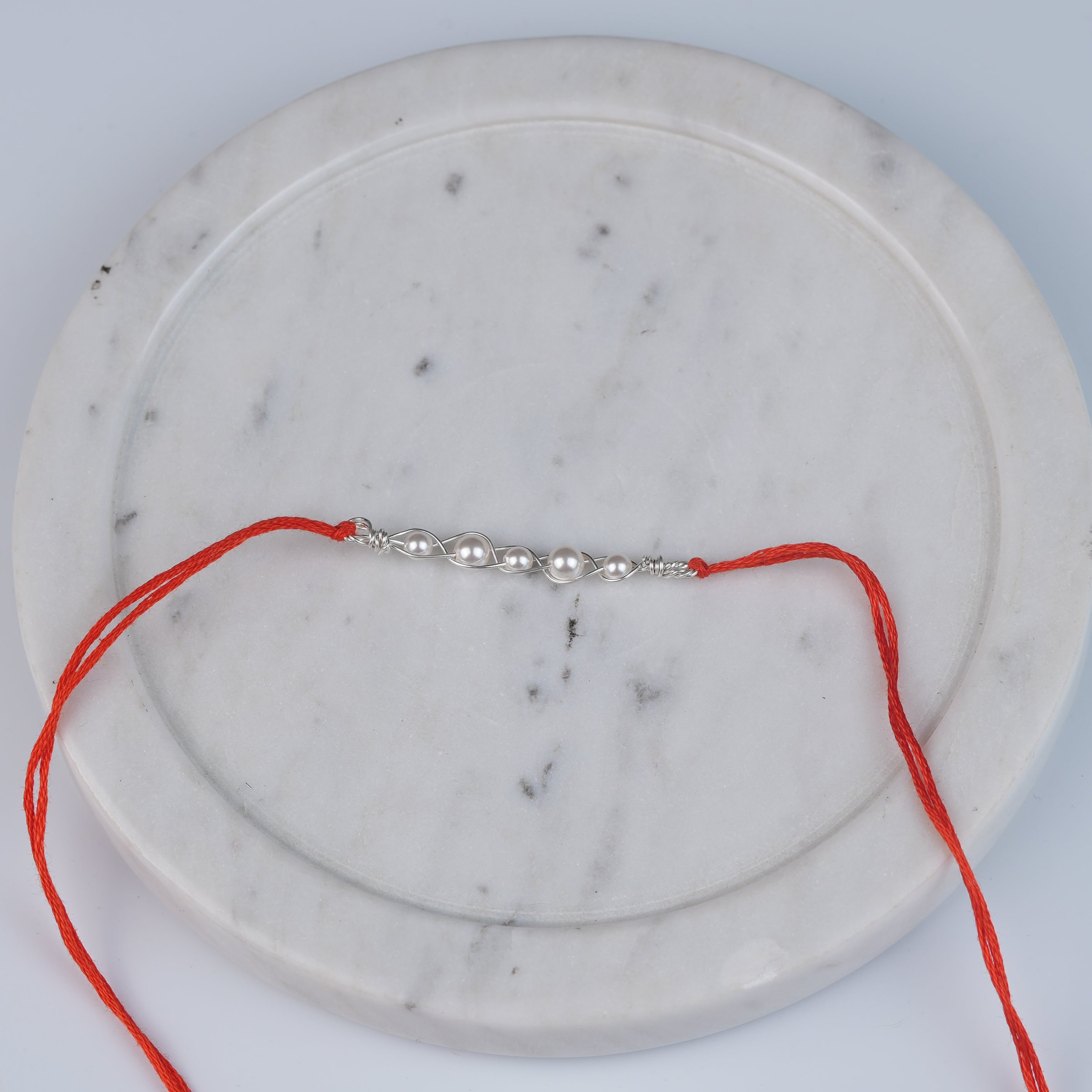 Pearl Wrapped Rakhi (Project Handmade)