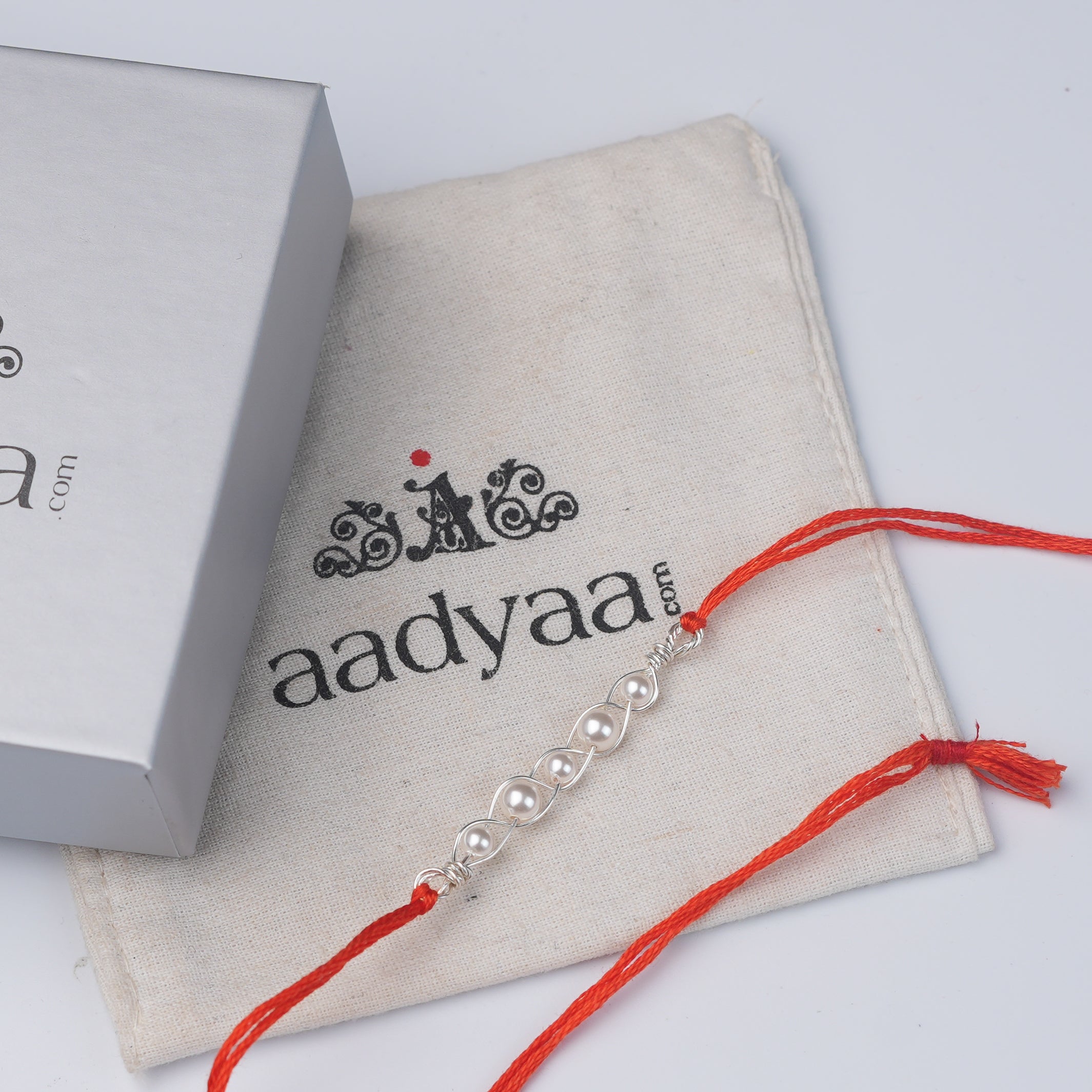 Pearl Wrapped Rakhi (Project Handmade)
