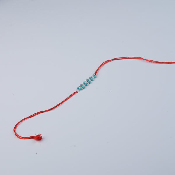 Turquoise Ganthan Rakhi (Project Handmade)