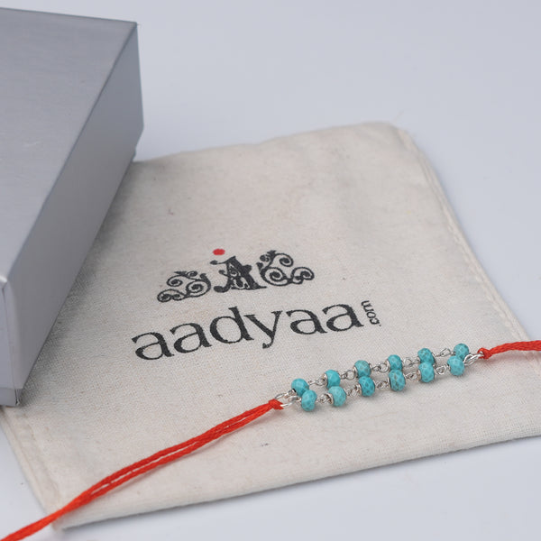 Turquoise Ganthan Rakhi (Project Handmade)