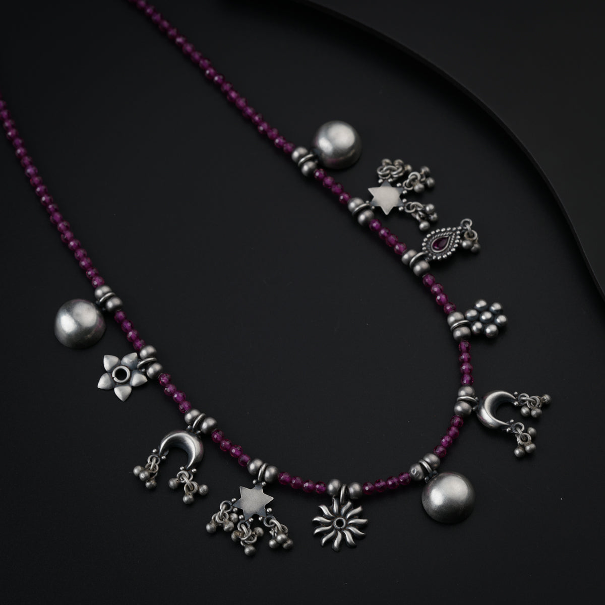 Silver Charms Motifs Necklace with Ruby