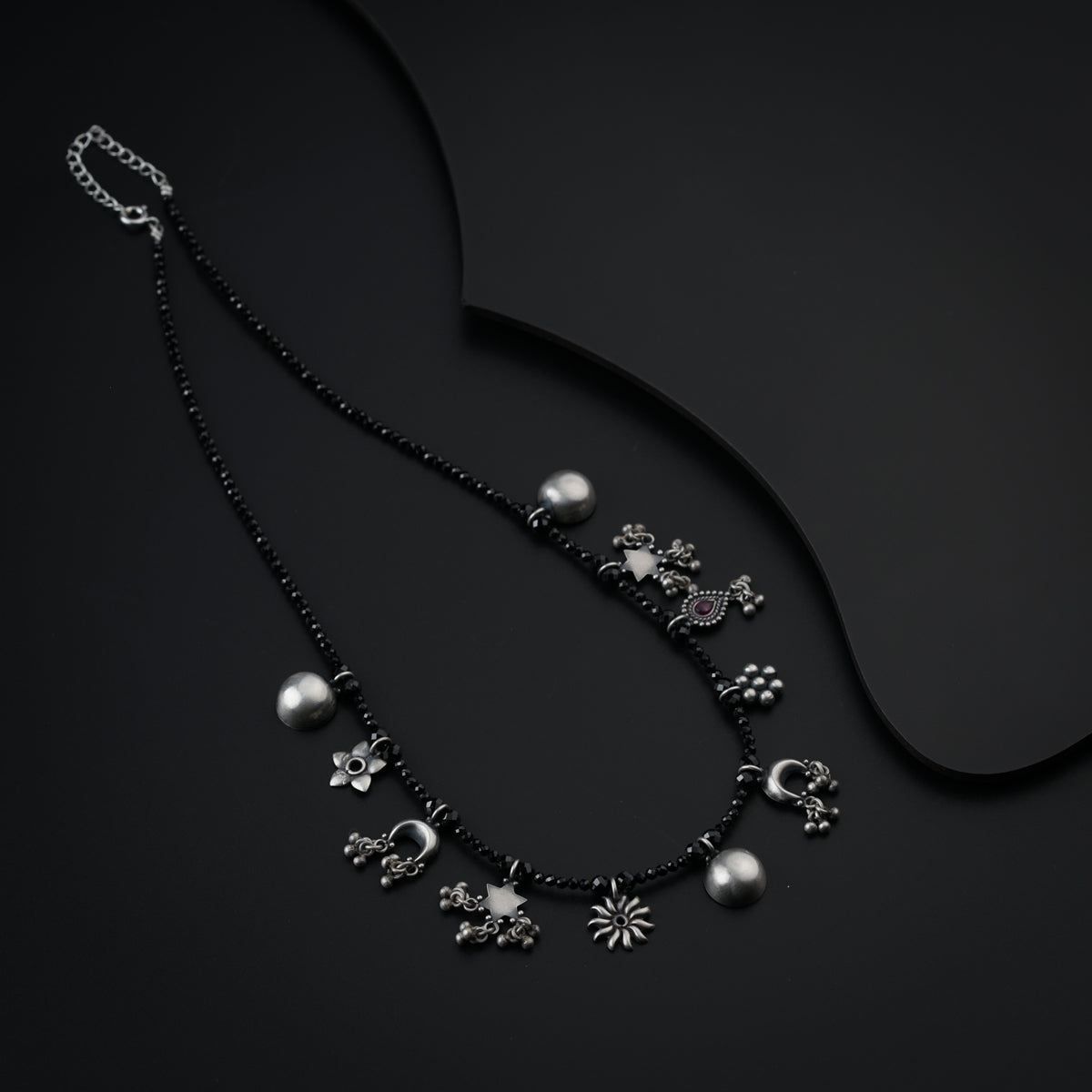 Silver Charms Motifs Necklace with Black Spinel