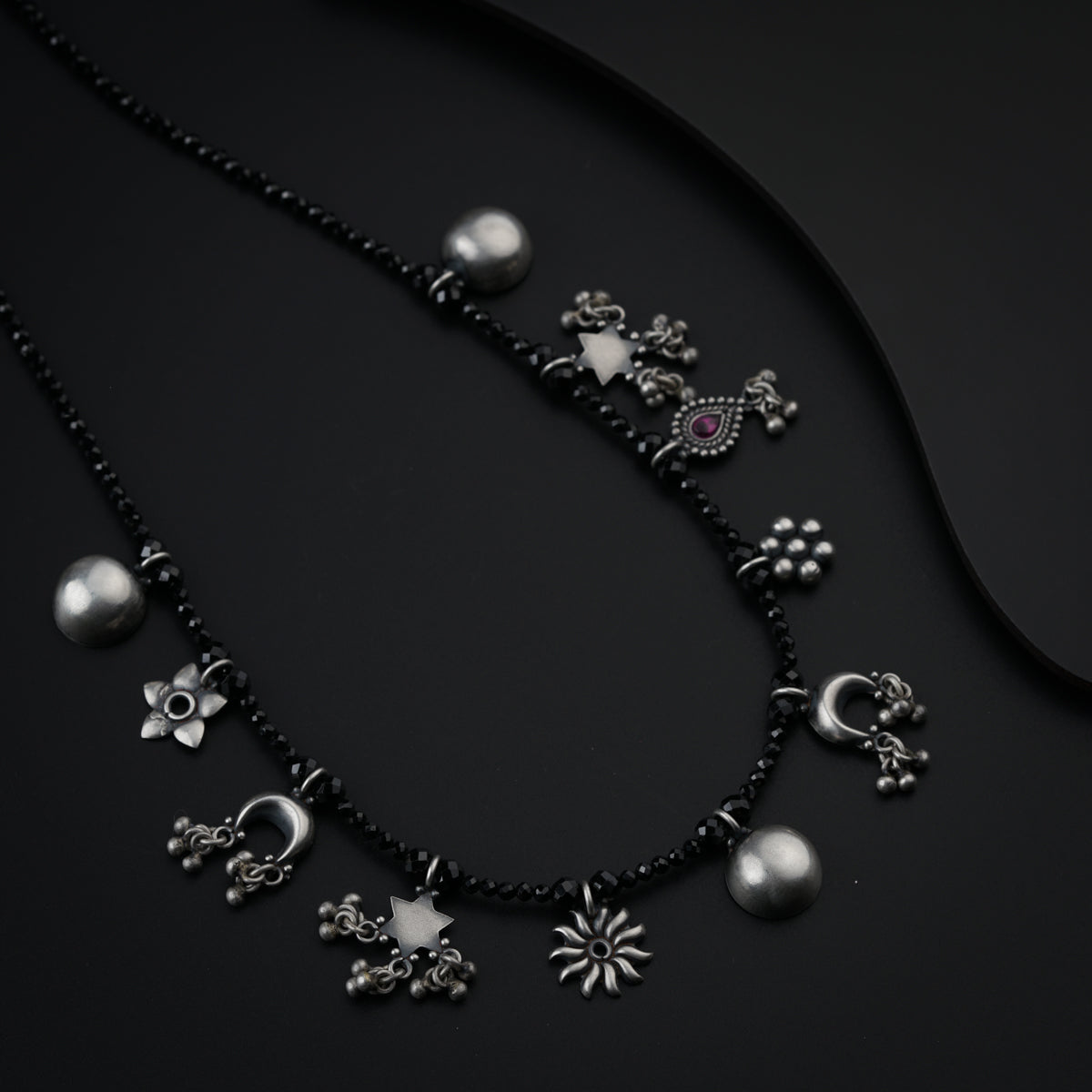 Silver Charms Motifs Necklace with Black Spinel