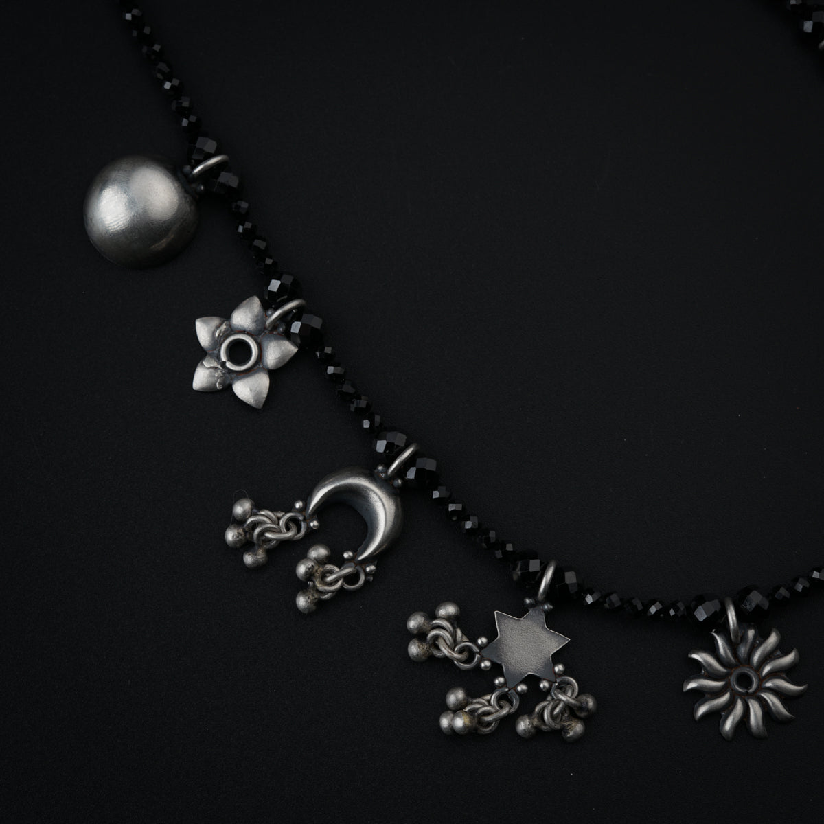 Silver Charms Motifs Necklace with Black Spinel