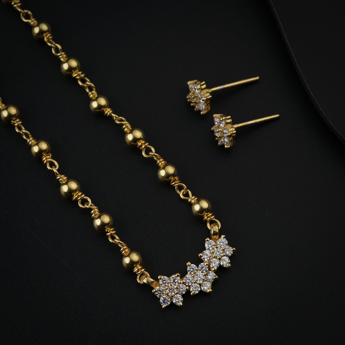 Stone Studded Flower Motif Small Set with Silver Beads Gold Plated