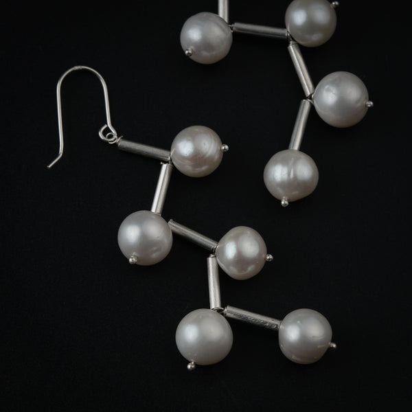 Close-up of Pearl Dangler Earring with silver hooks and pearl beads