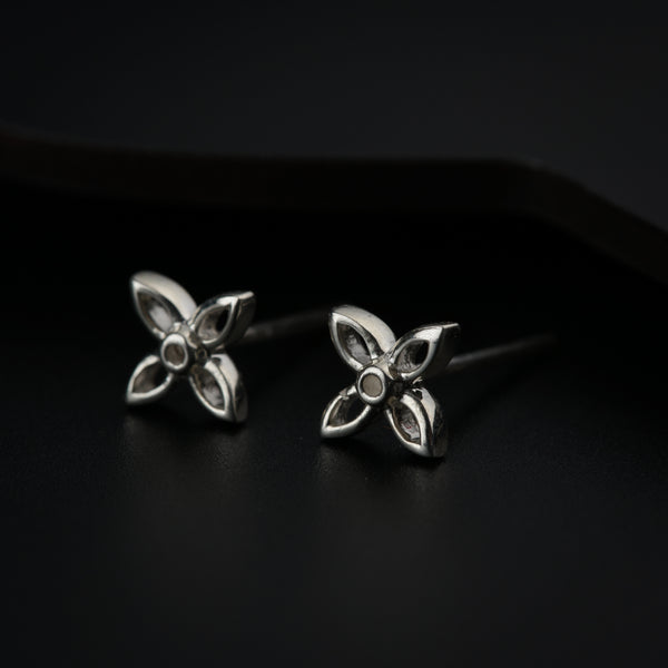 Silver flower earrings close-up