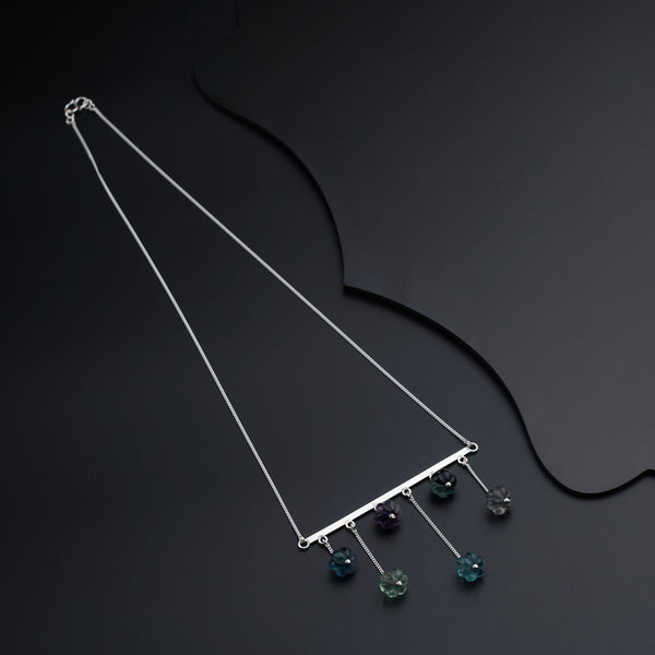 a necklace that has a bunch of beads hanging from it
