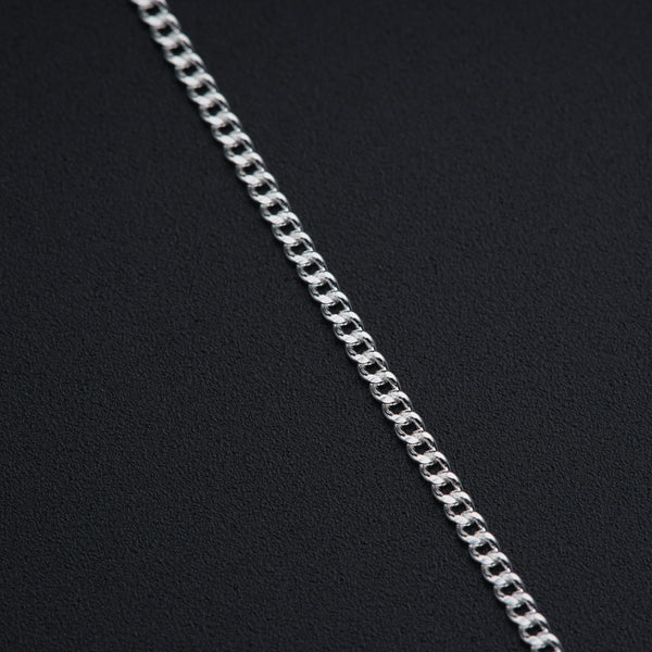 a close up of a chain on a black surface