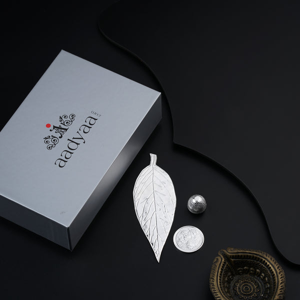 Silver gift set with beetel leaf and coin in elegant packaging