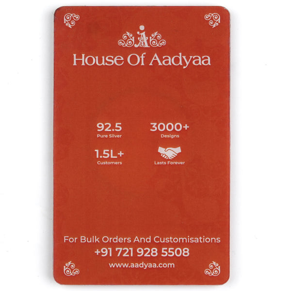 Flat-lay of Tree of Life (Kalpavruksha) Silver Coin (1 gm) with elegant gift box and festive décor