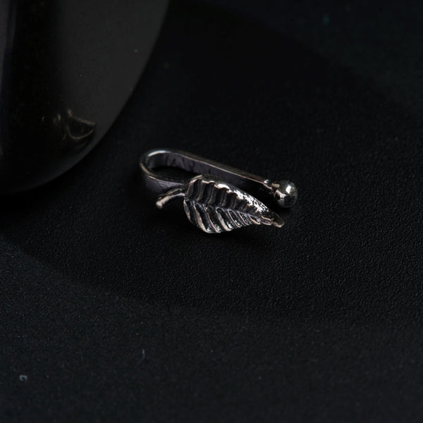 a silver ring with a leaf on it
