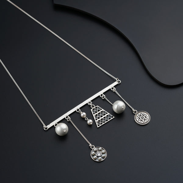 a close up of a necklace on a black surface