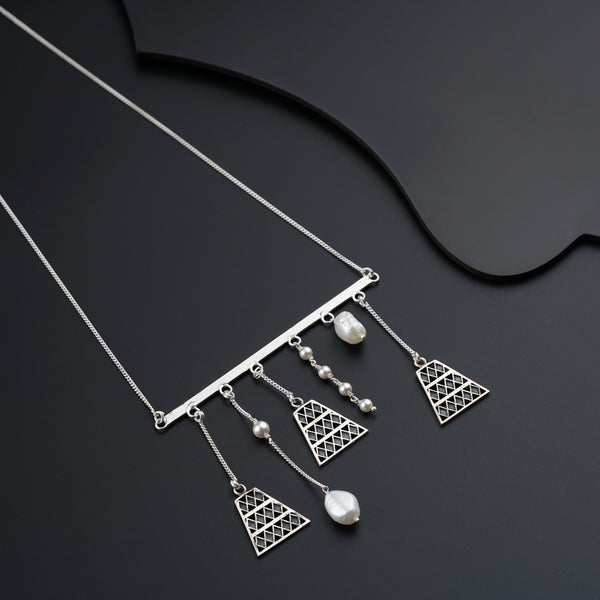 a close up of a necklace on a black surface