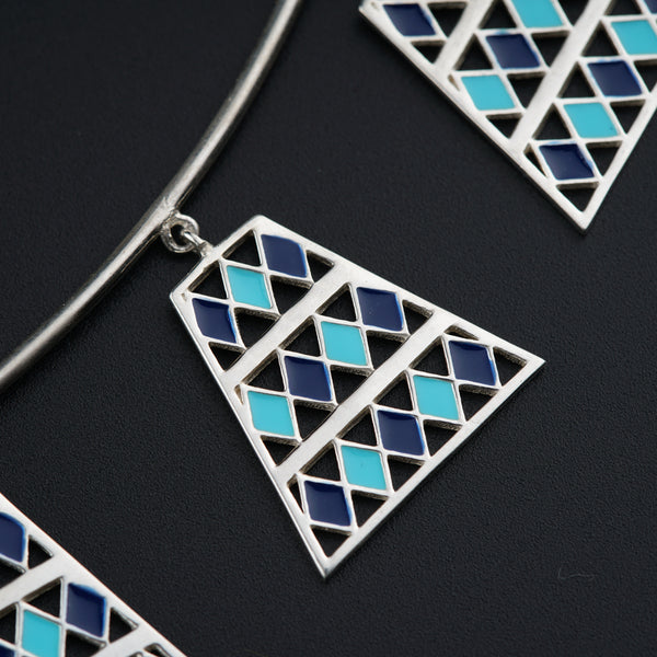 a close up of a necklace on a black surface
