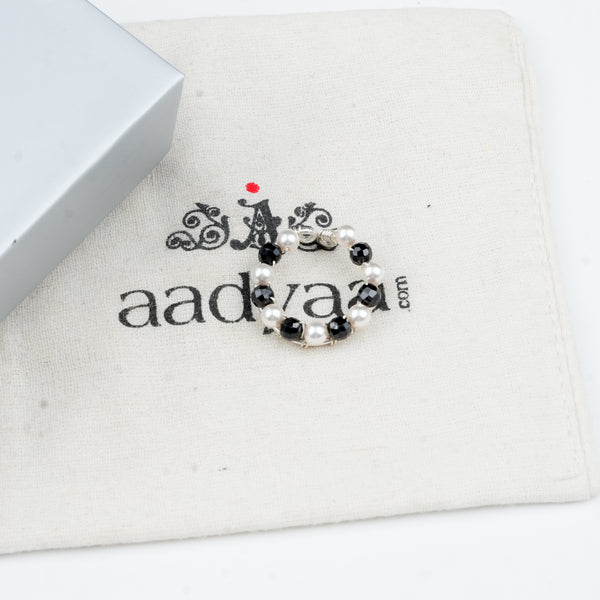 Sterling silver ring with black spinel and pearl detailing