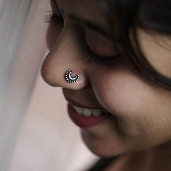 Silver Chandrakor nose pin on nose