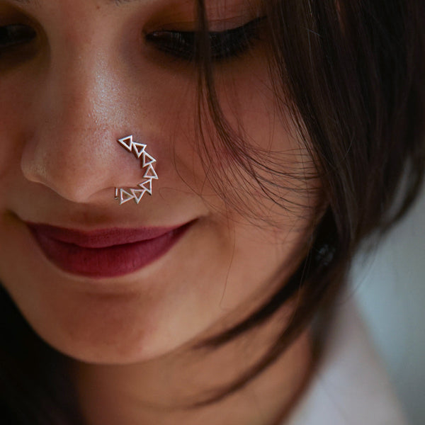 Sterling silver geometric nose ring on woman's nose