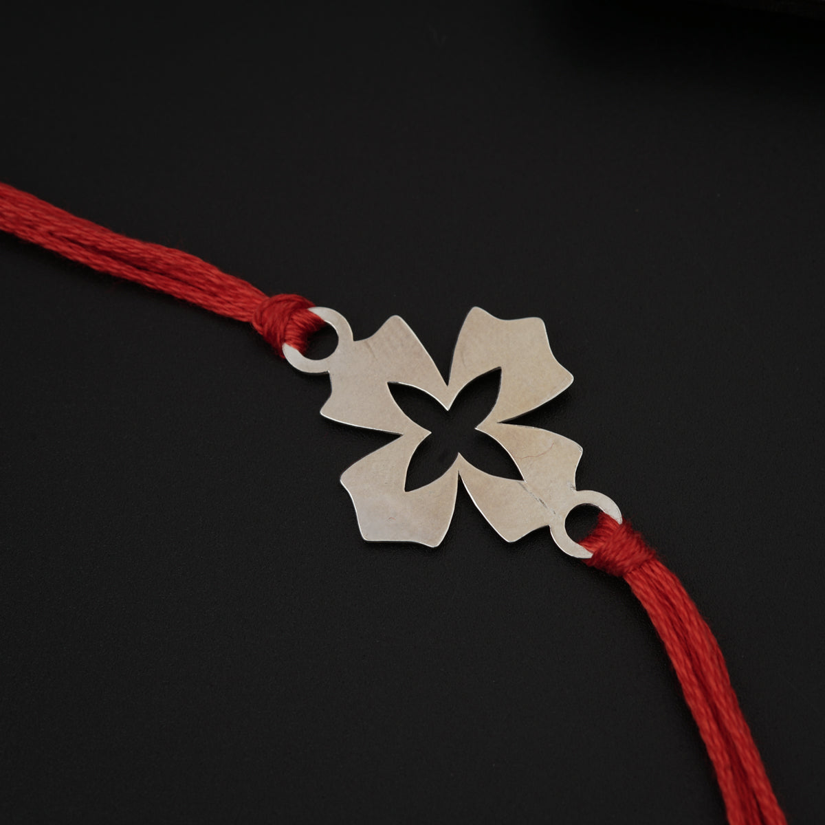 Silver Laser cut Flower Rakhi