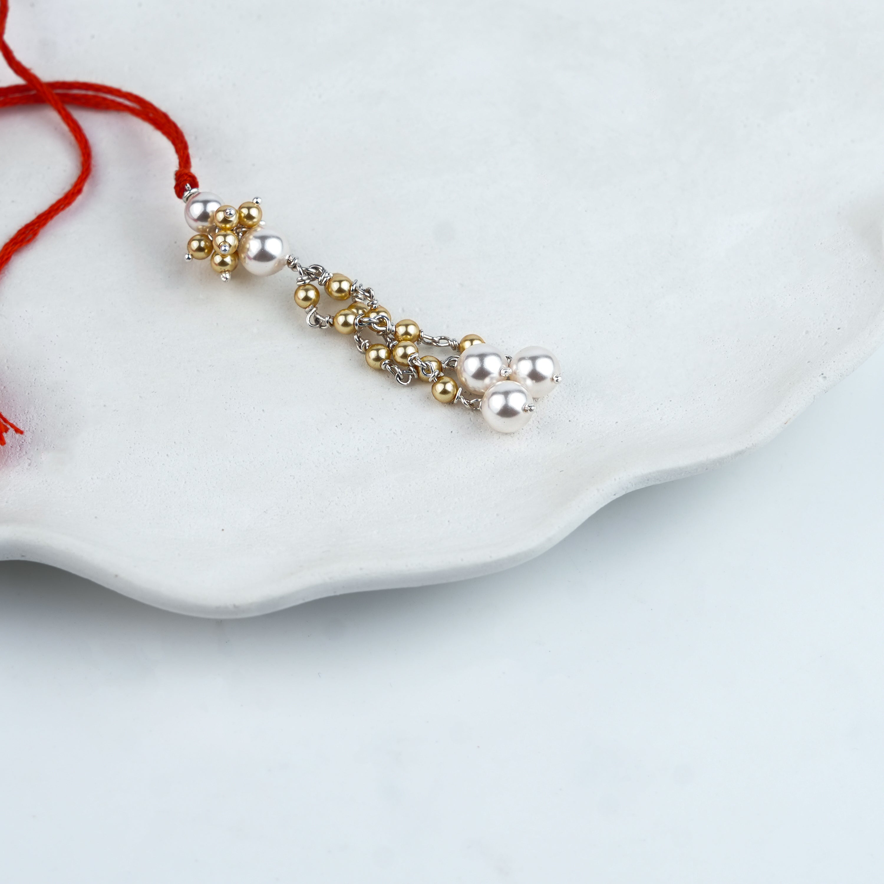 Golden & White Pearl Handmade Silver Lumba Rakhi