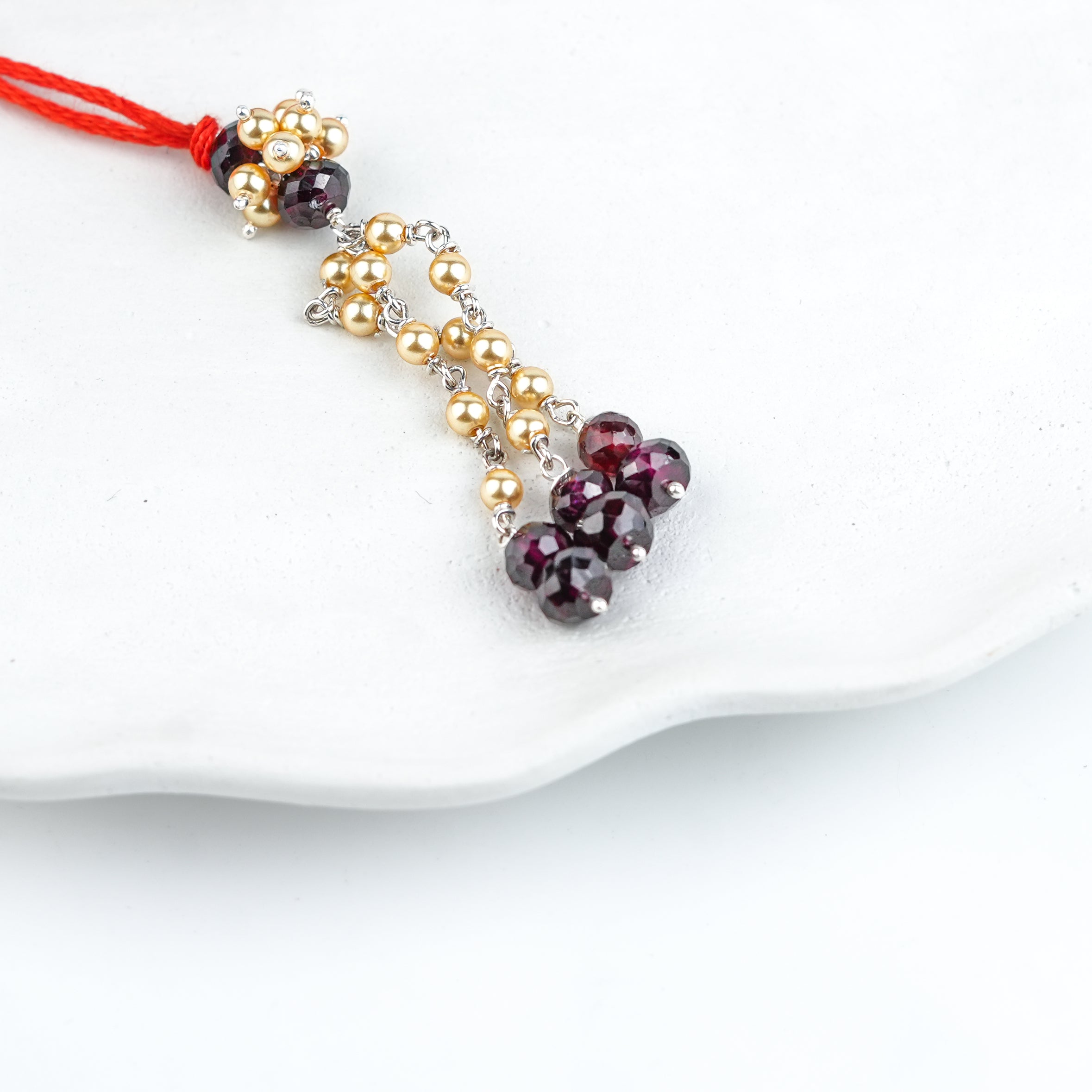 Garnet & Golden Pearl Handmade Silver Lumba Rakhi