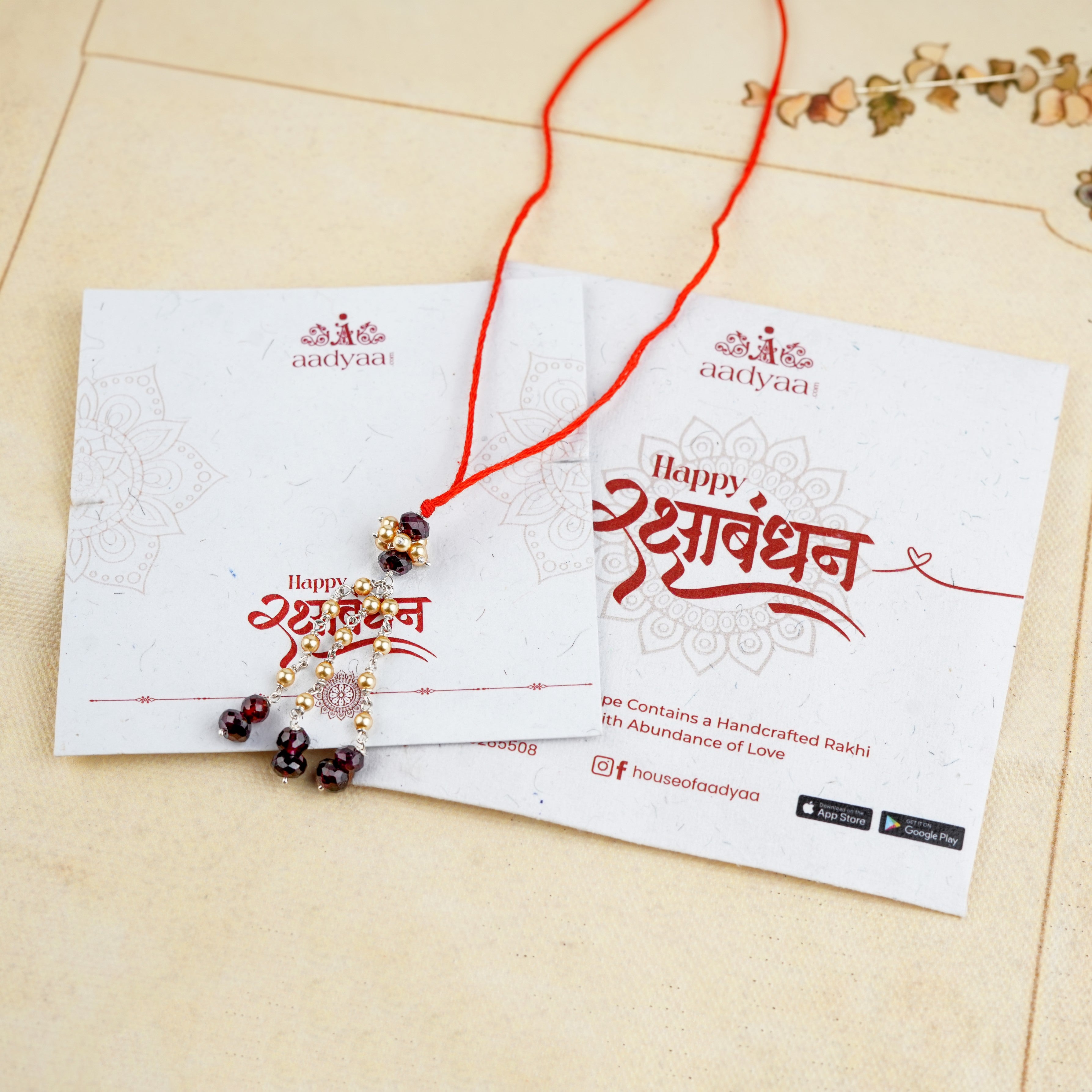 Garnet & Golden Pearl Handmade Silver Lumba Rakhi
