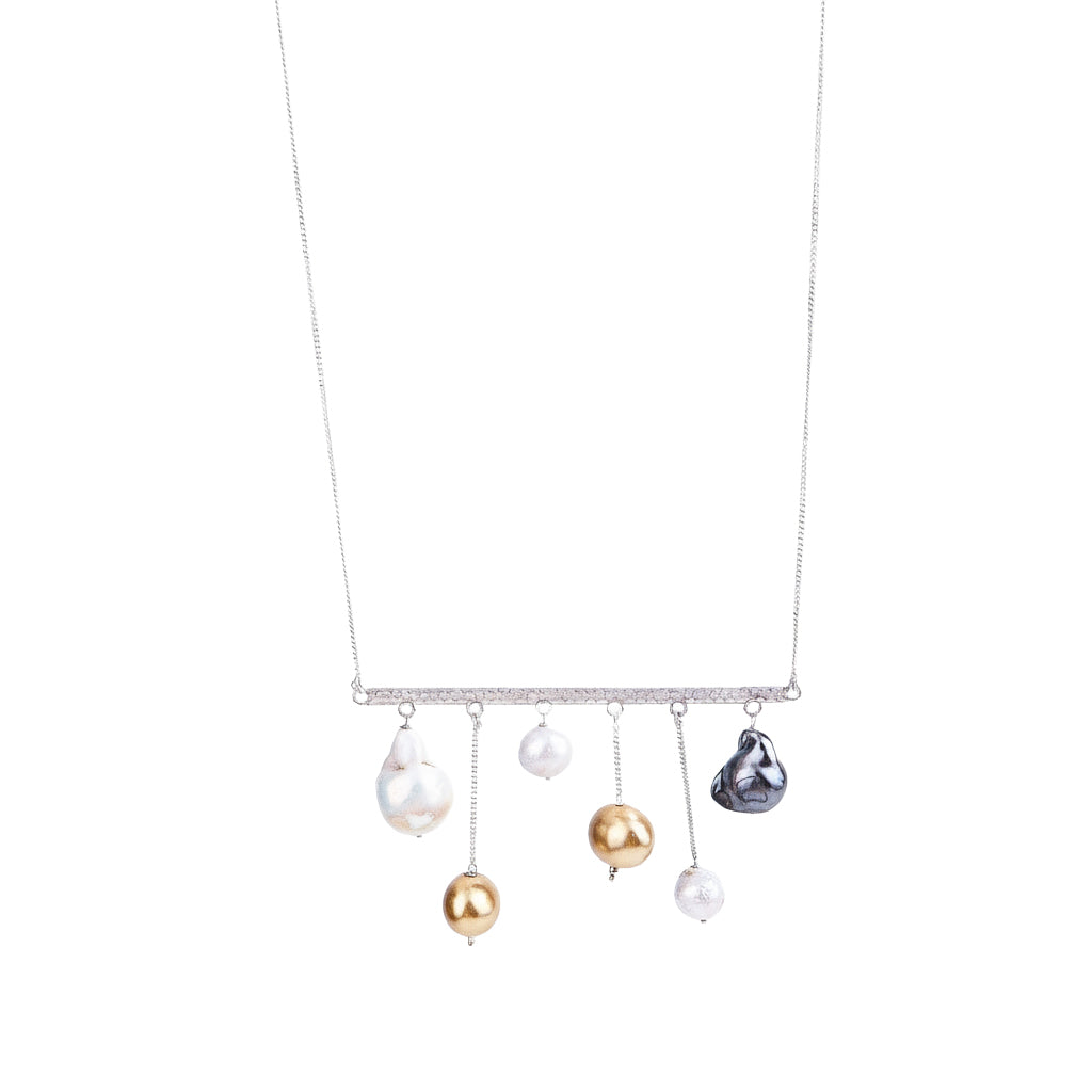 wear abstract silver necklace with pearls for modern styling