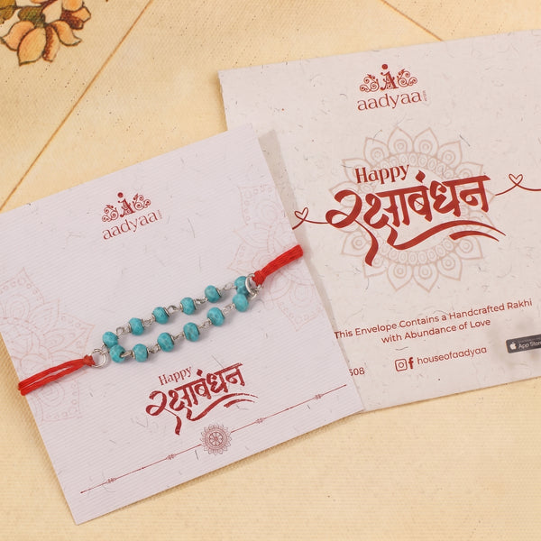 Turquoise Ganthan Rakhi (Project Handmade)