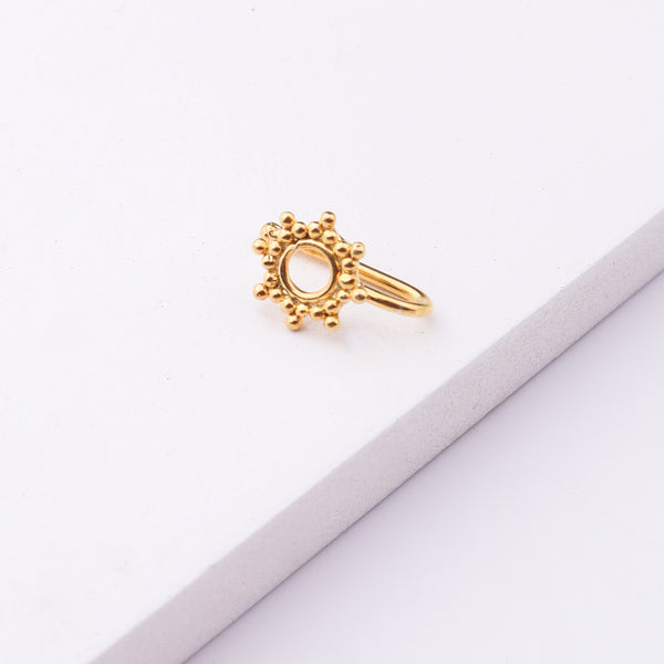 Gold-plated circular nose pin with beaded border