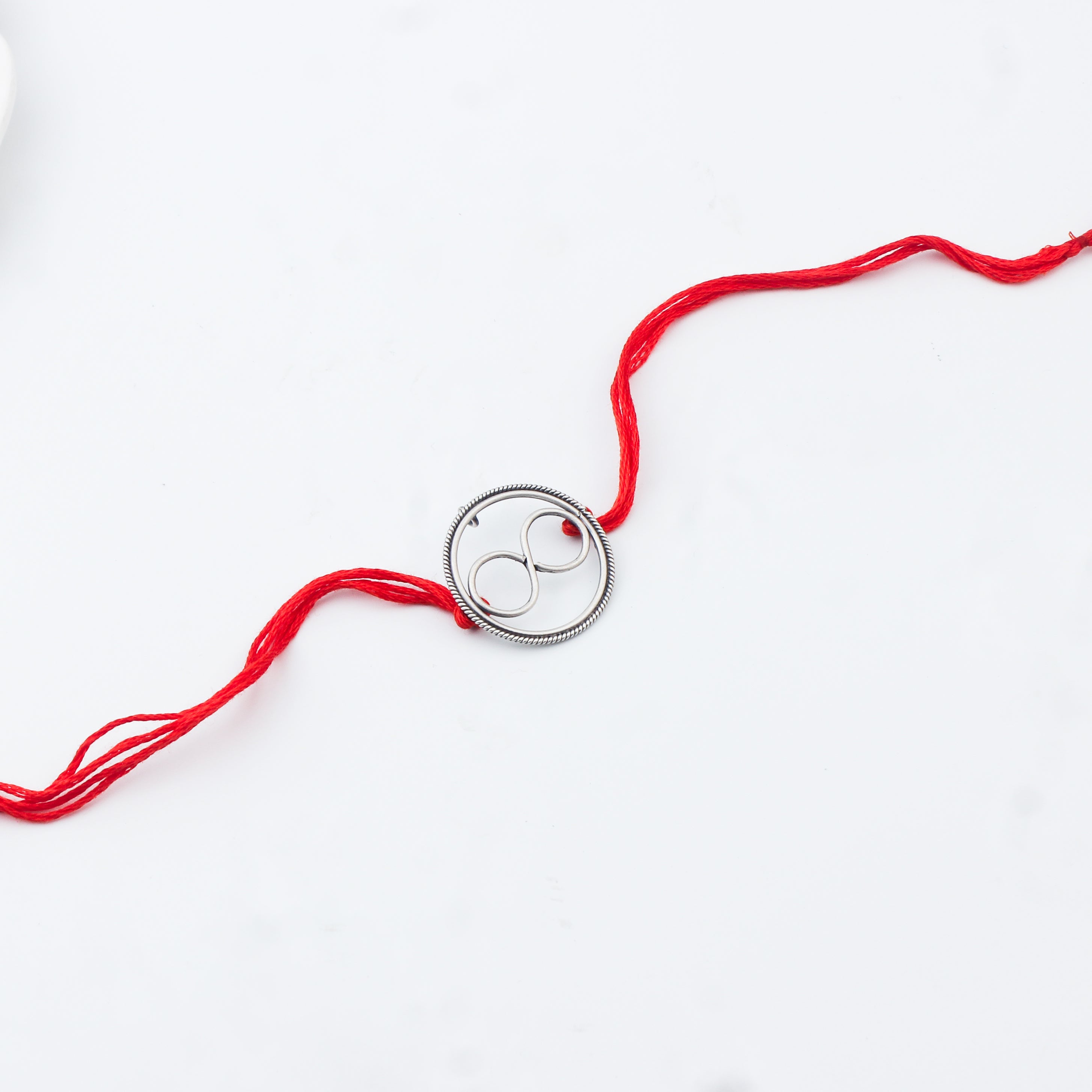 Handcrafted Silver Rakhi/Pendant: Infinity