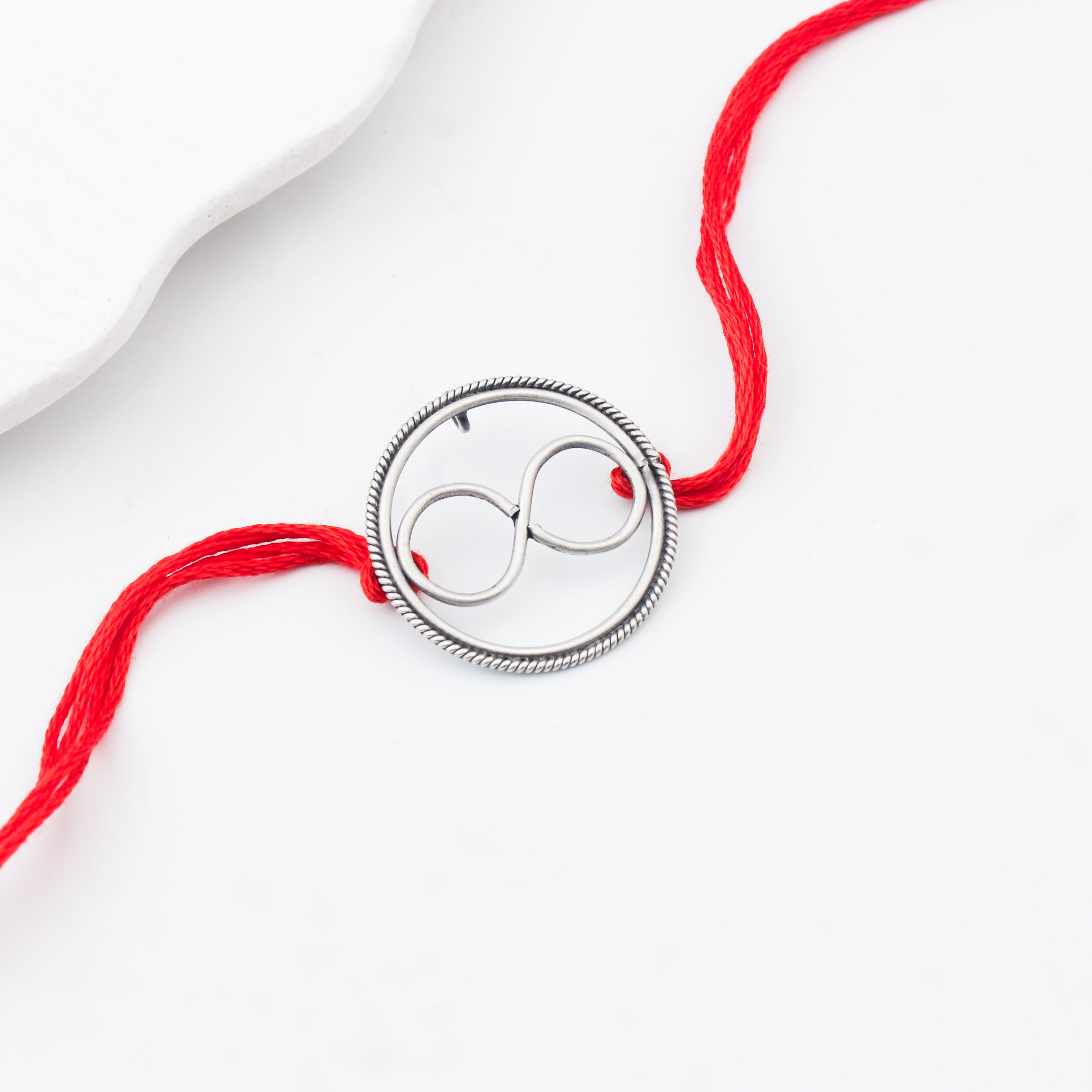 Handcrafted Silver Rakhi/Pendant: Infinity