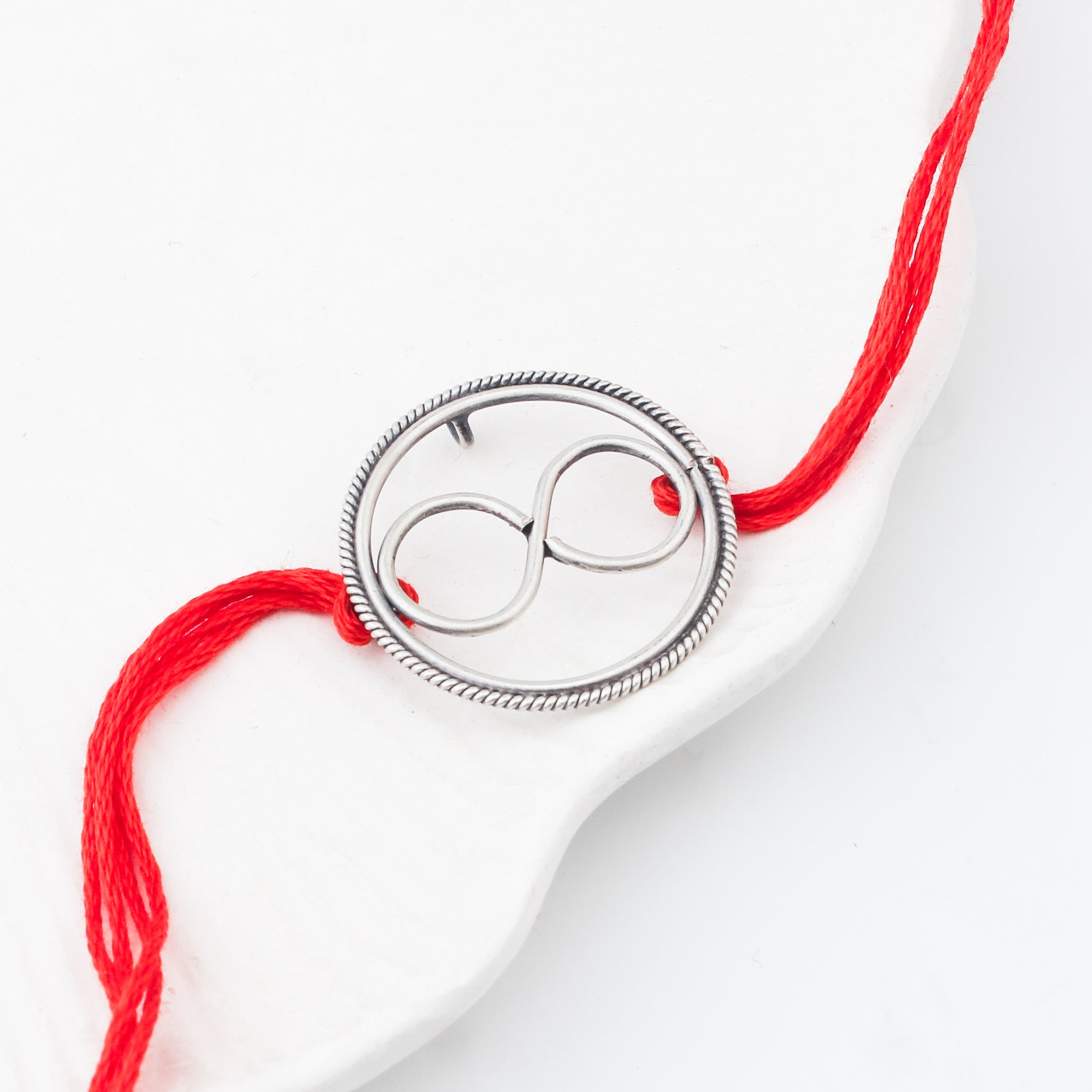 Handcrafted Silver Rakhi/Pendant: Infinity
