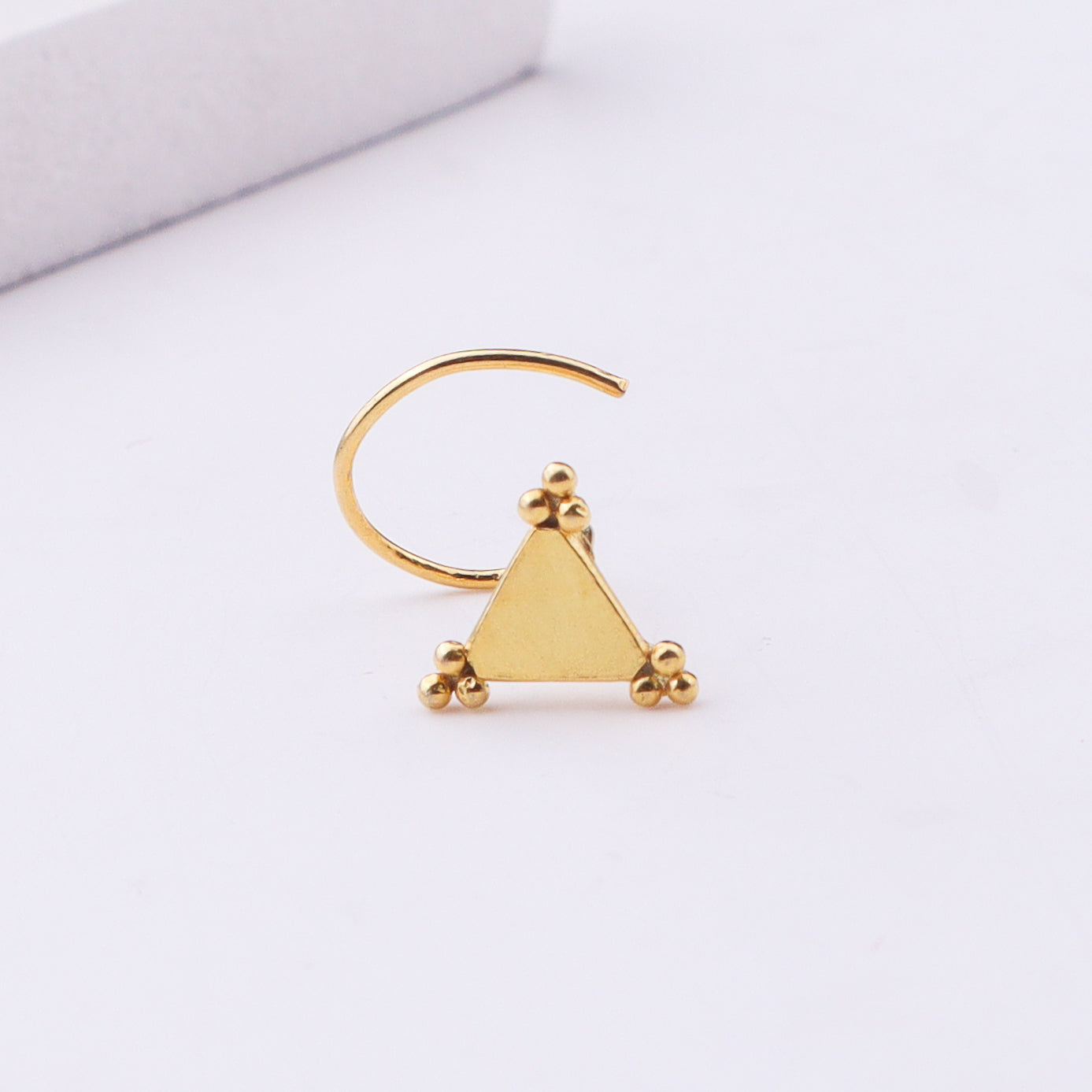 Gold triangle nose pin with ball accents