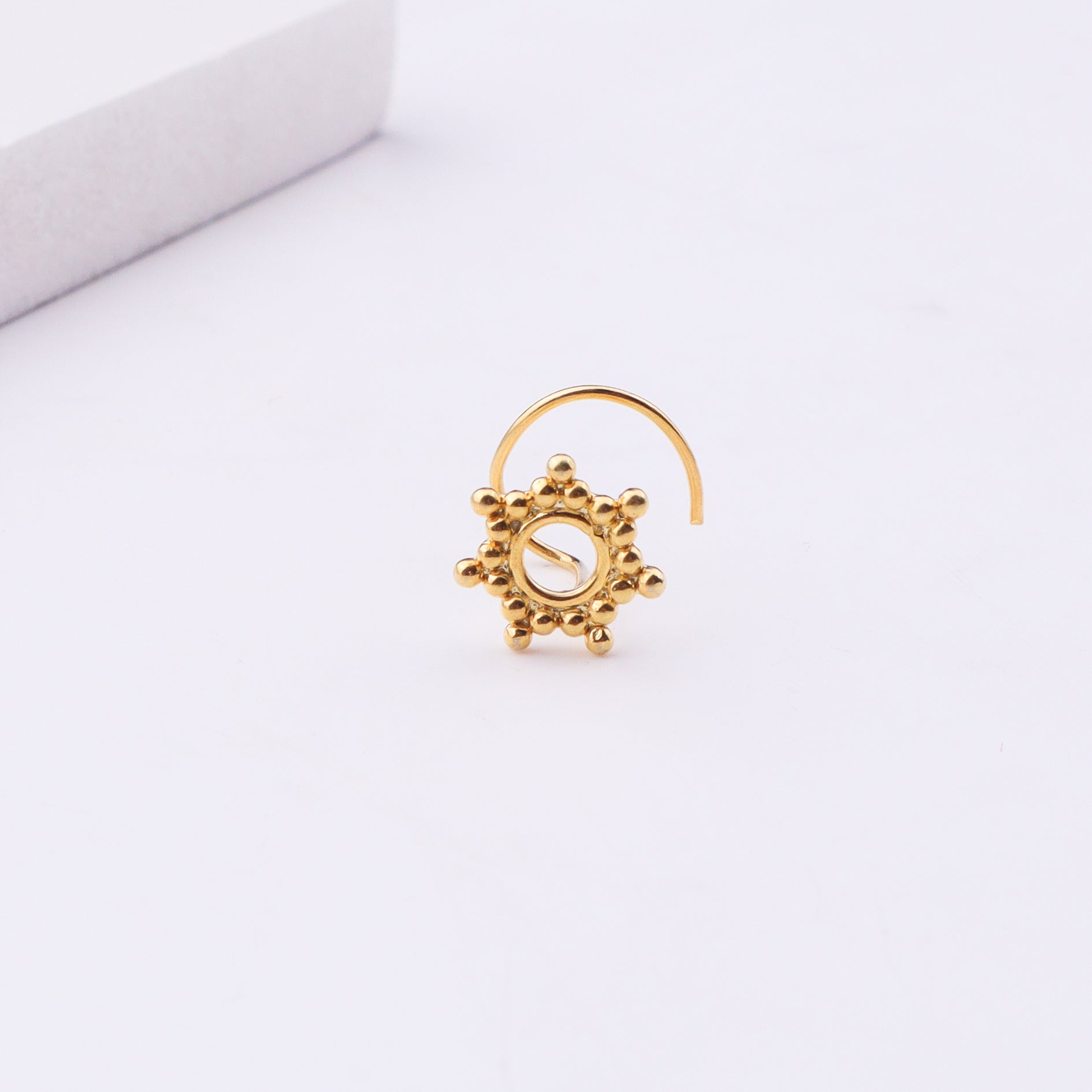 Gold plated nose pin with floral design
