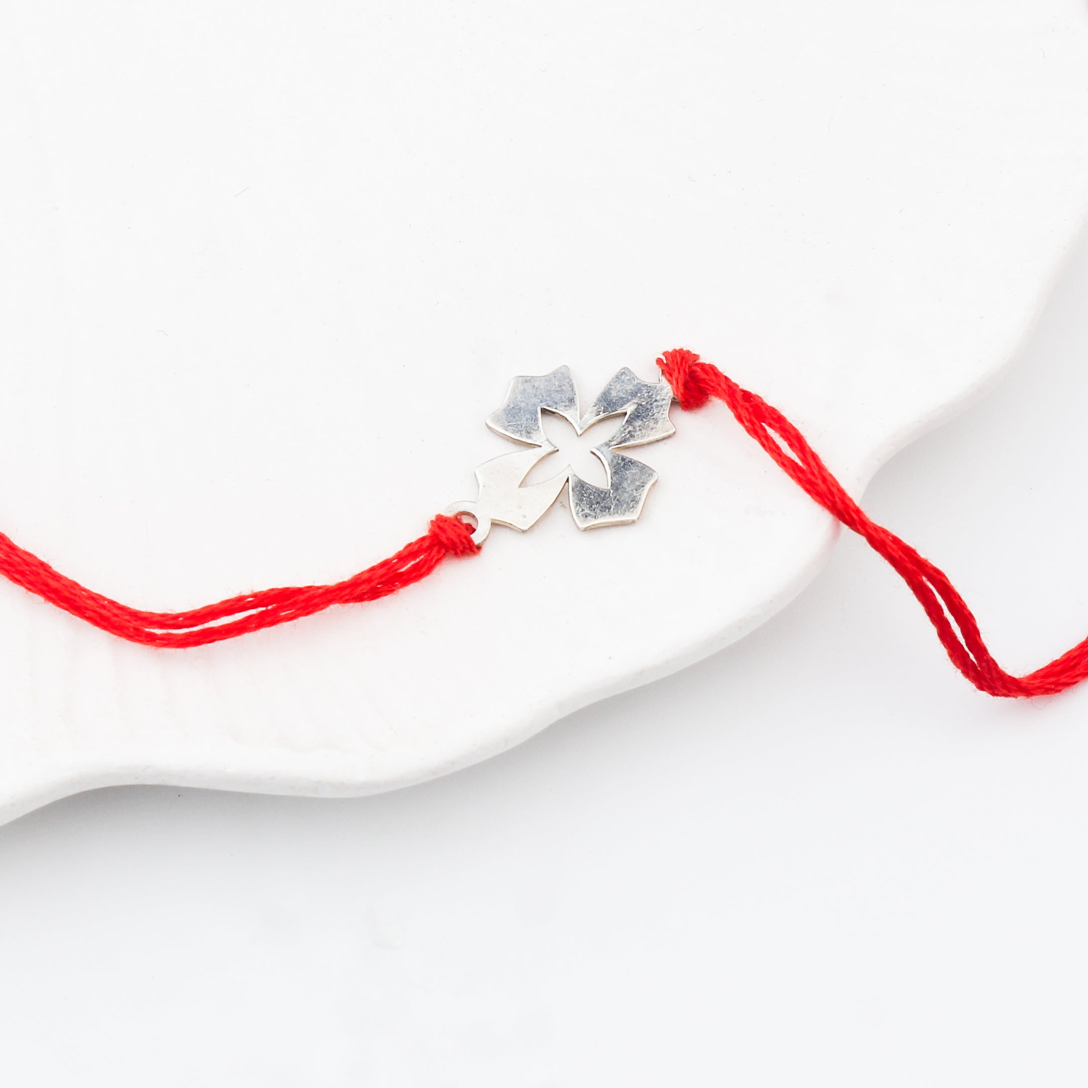Silver Laser cut Flower Rakhi