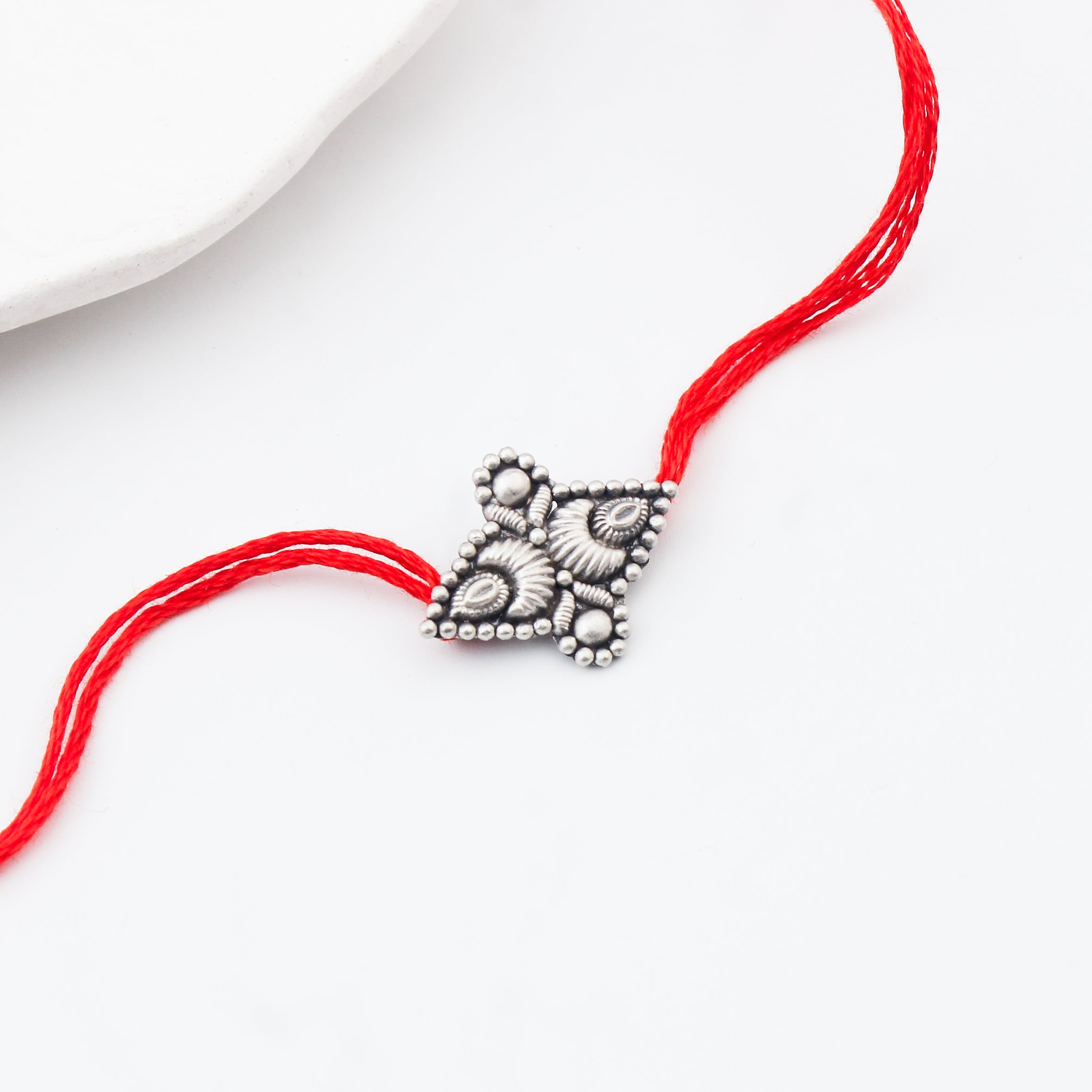 Handcrafted Silver Rakhi/Pendant: Chandrakor & Drop Motif