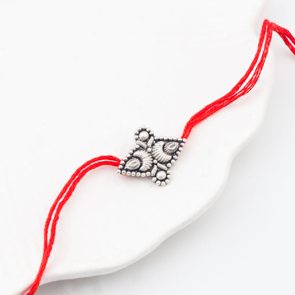 Handcrafted Silver Rakhi/Pendant: Chandrakor & Drop Motif