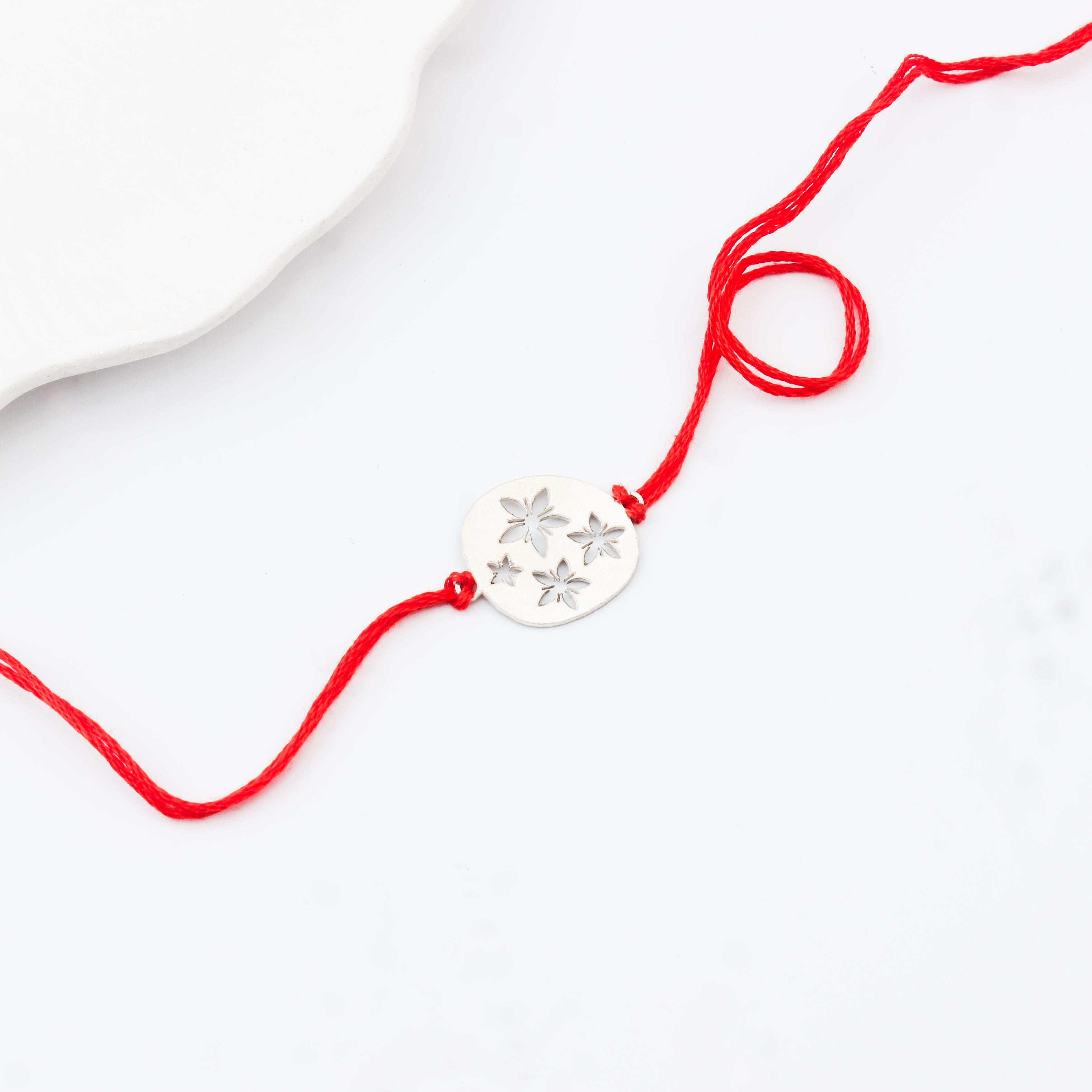 Silver Laser Cut Floral Rakhi