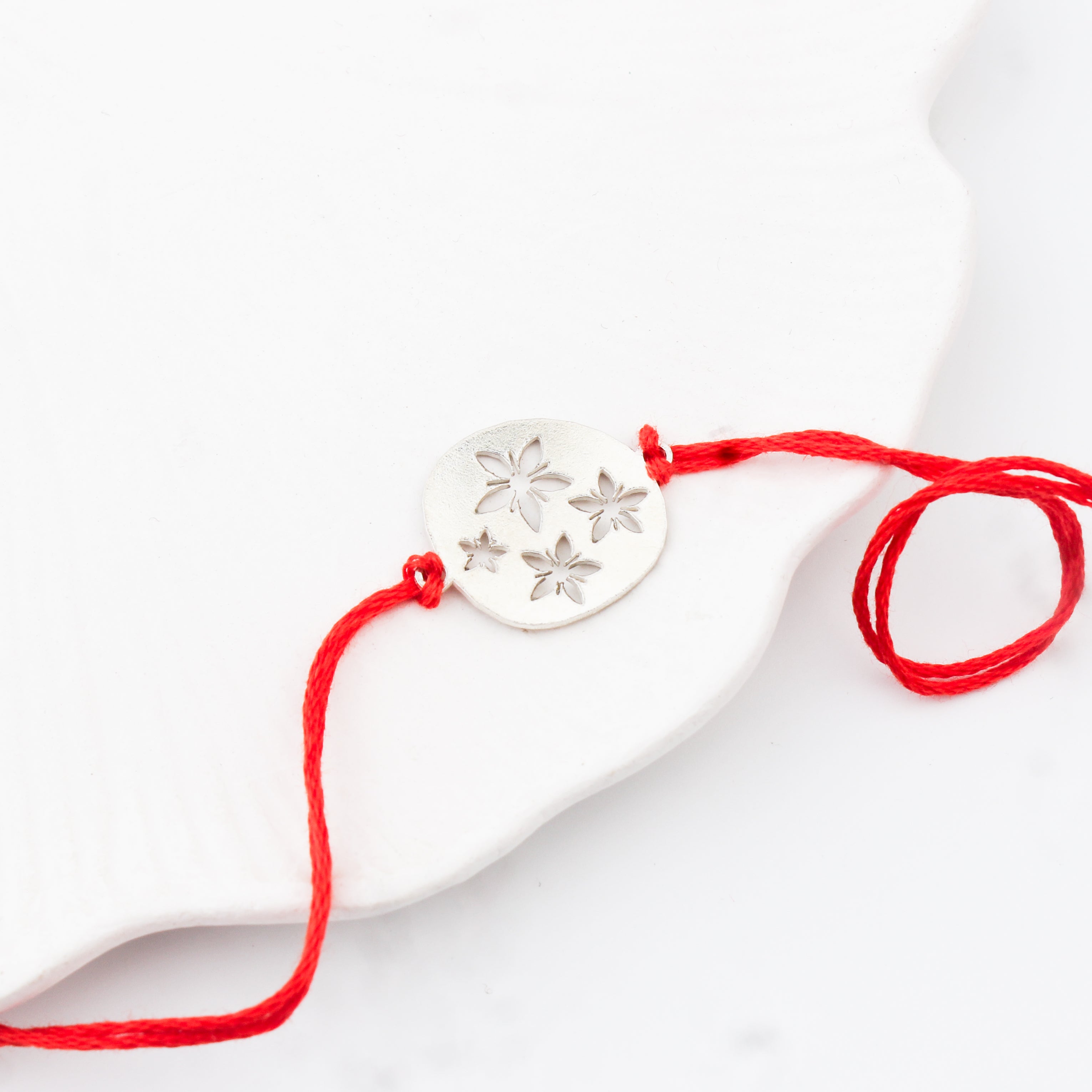 Silver Laser Cut Floral Rakhi