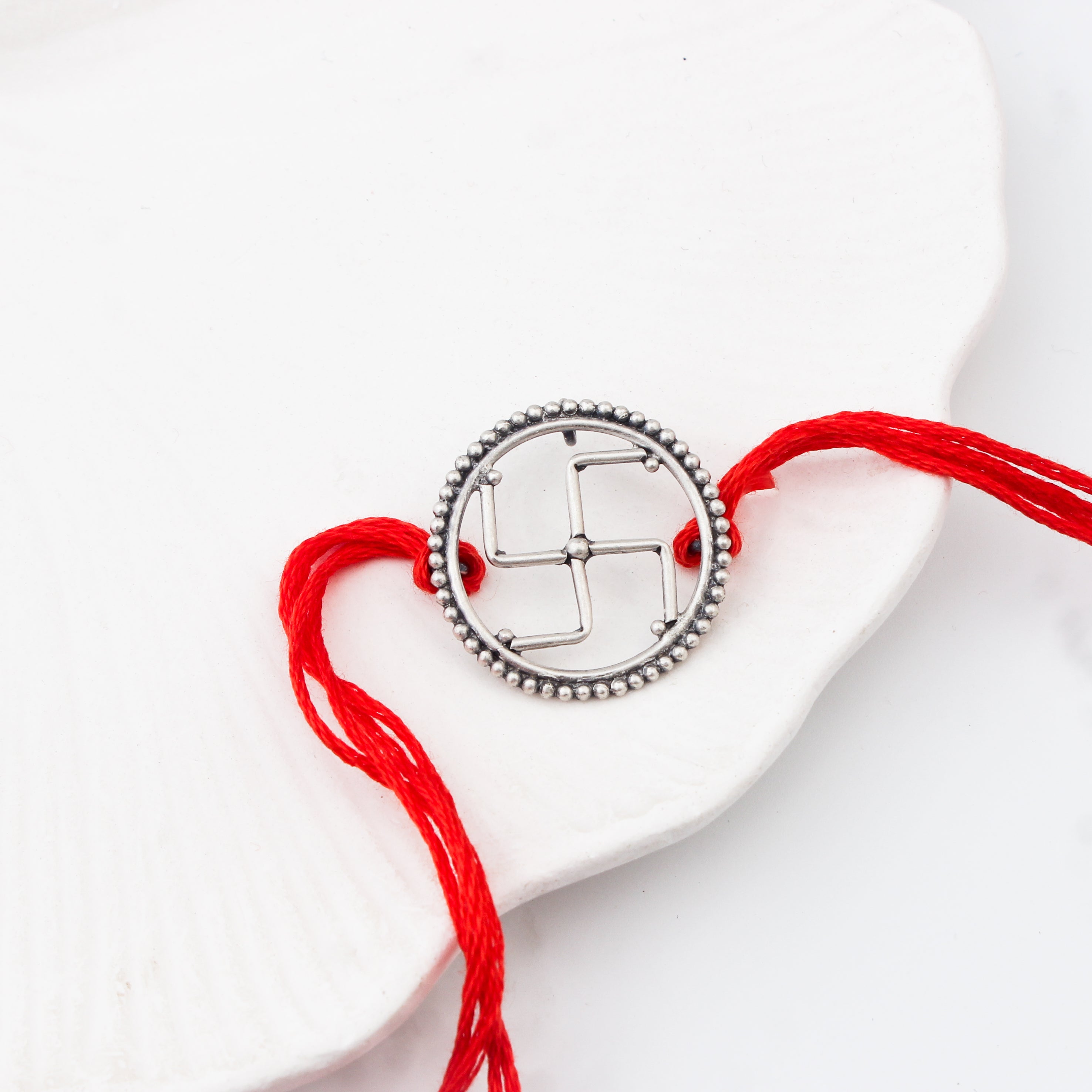 Handcrafted Silver Rakhi/Pendant: Swastik
