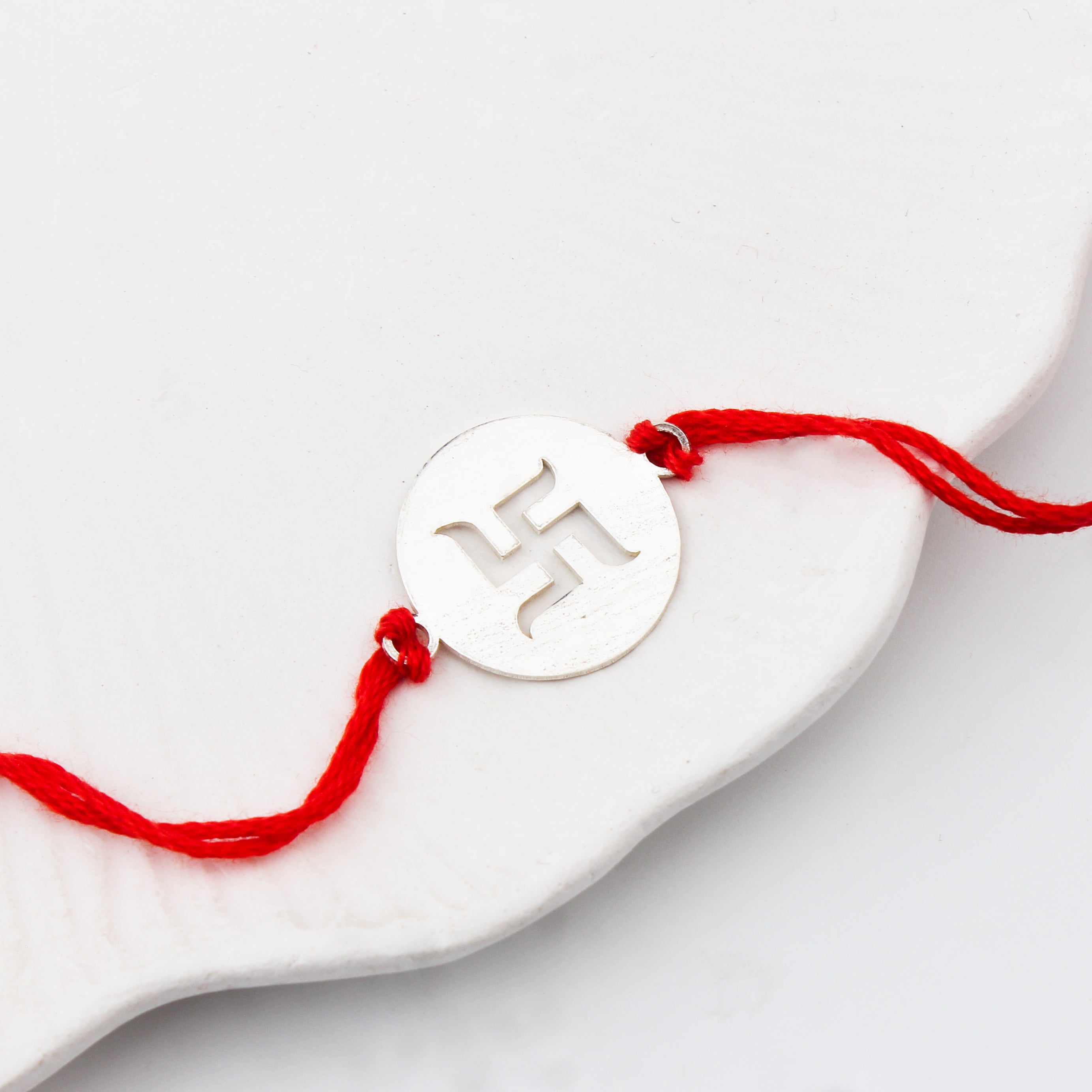 Handcrafted Silver Rakhi: Swastik