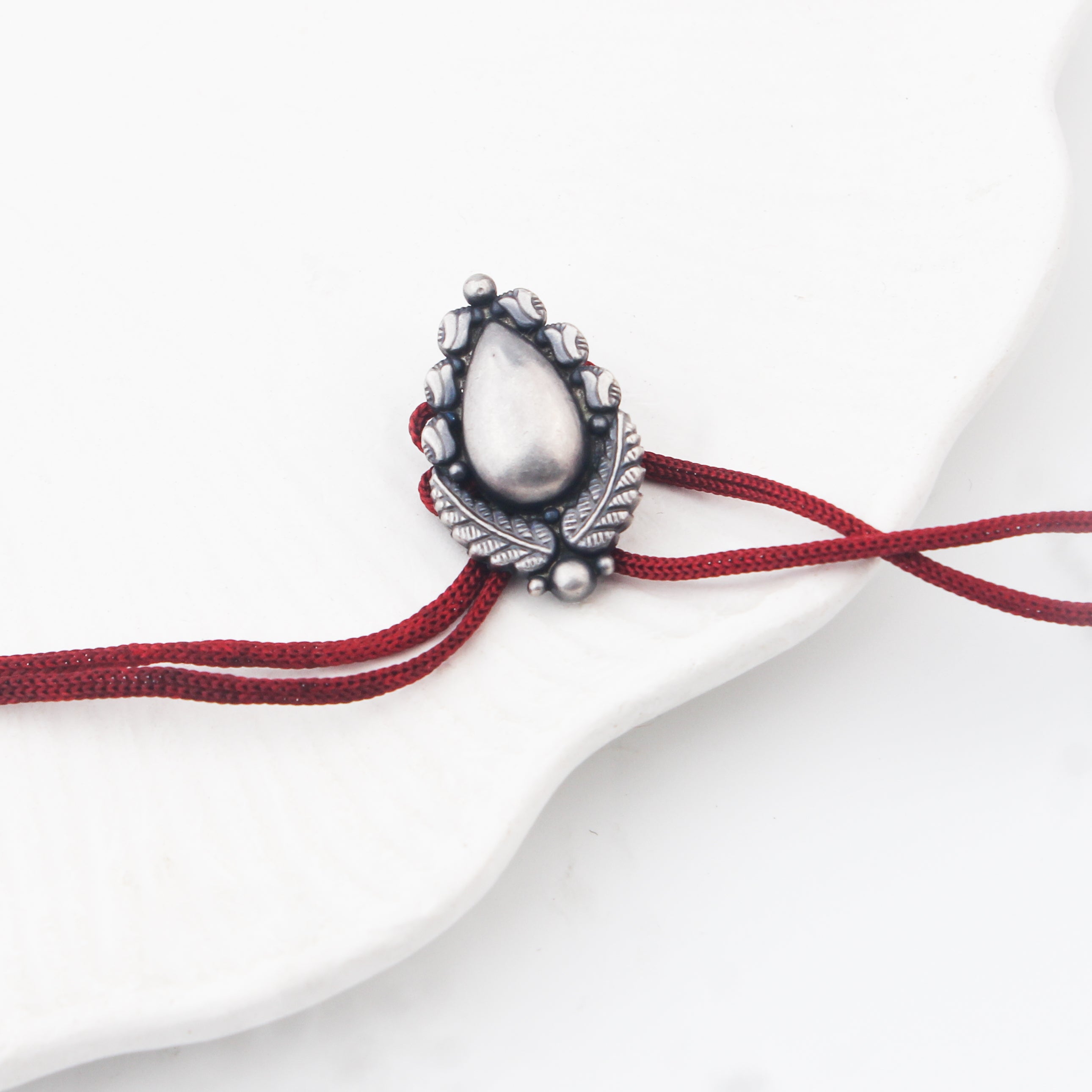 Handcrafted Silver Rakhi/Pendant: Drop