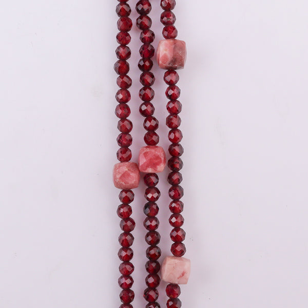 Red beaded necklace with pink stone accents, jewelry accessory