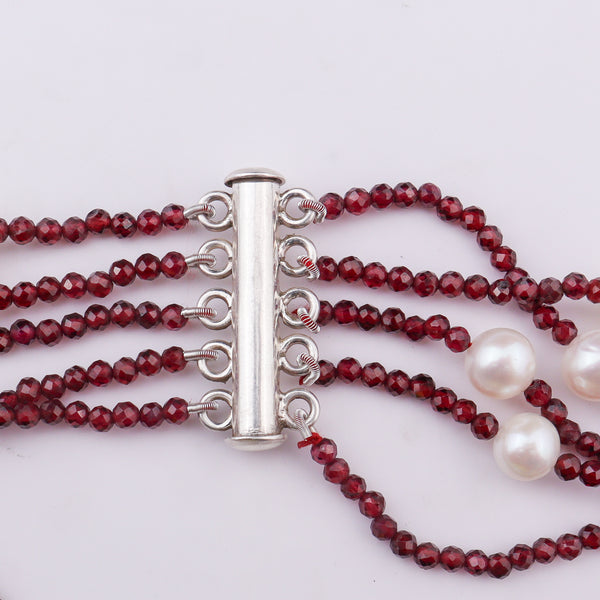 Red beaded necklace with silver clasp and white pearls