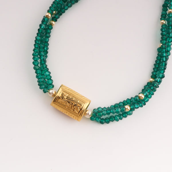 Green onyx beaded necklace with gold accents and tassel closure