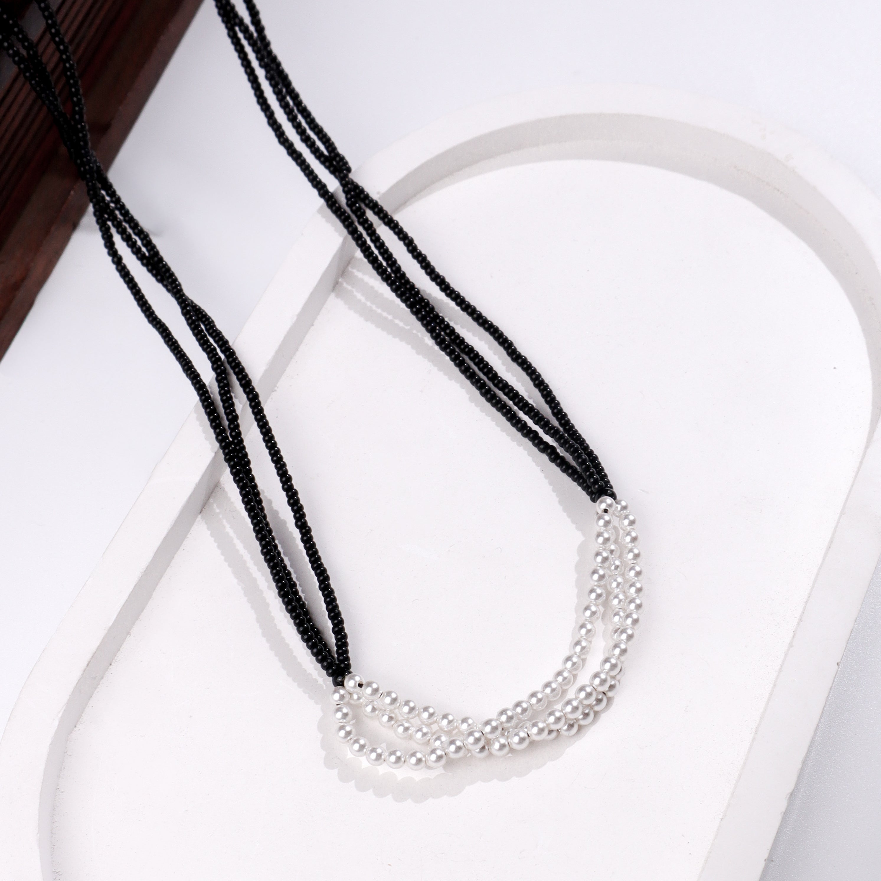 White Pearl Bunch Mangalsutra with black beaded strands and silver pearl accents