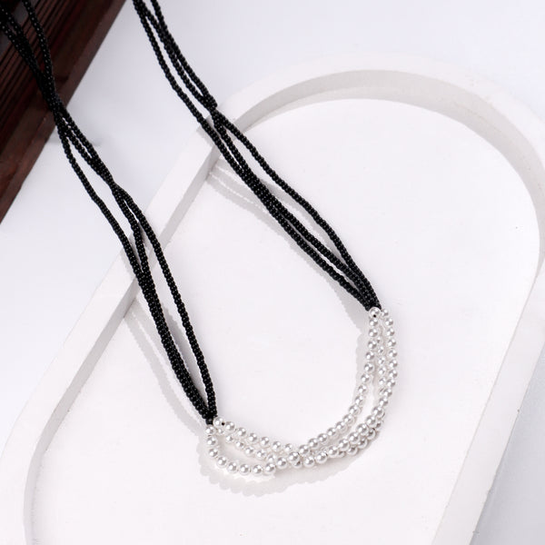 White Pearl Bunch Mangalsutra with black beaded strands and silver pearl accents
